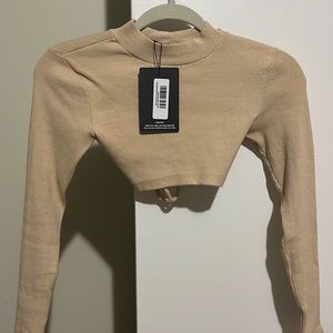 Tan ribbed open back cropped turtle neck
